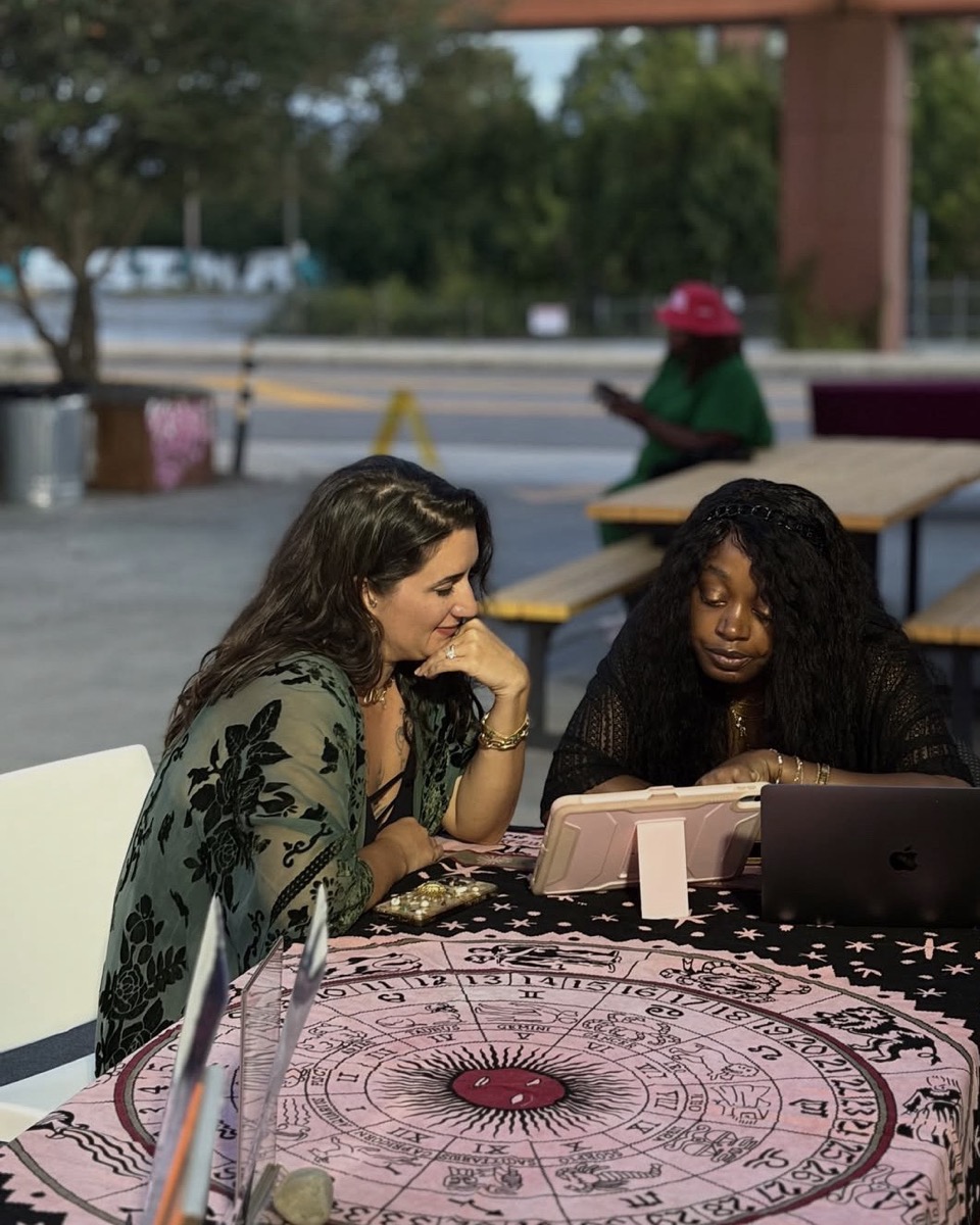 Traci giving a reading at a pop-up event